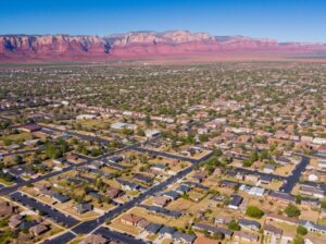 aerial view of a neighborhood in Cedar City with the rock landscapes behind