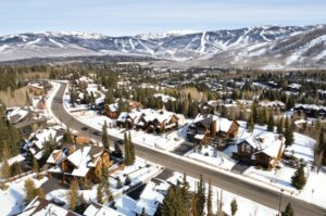 aerial view of snowy Park City, Utah with luxury resorts and mountains