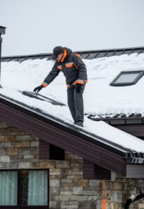 an HOA management employee conducting detailed inspection in Aspen homes