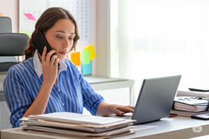HOA management employee taking calls to support Boulder City HOA board