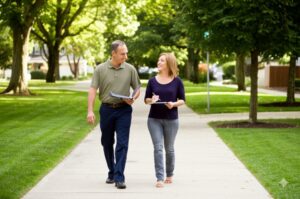 two professionals going around a neighborhood for community inspection