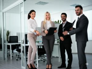 group of professionals welcoming visitors at their HOA management office